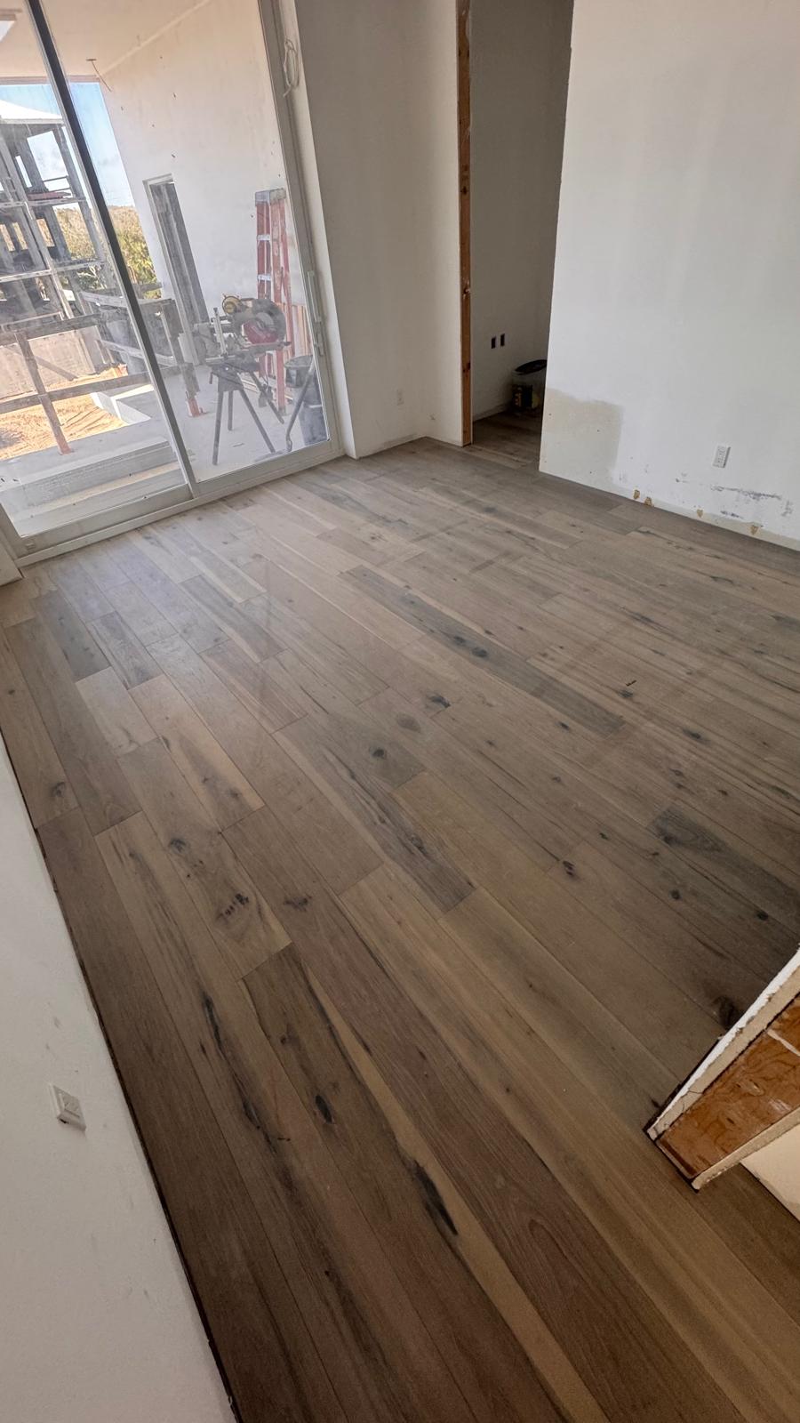 Veteran-owned vinyl plank installers working in a Melbourne home
